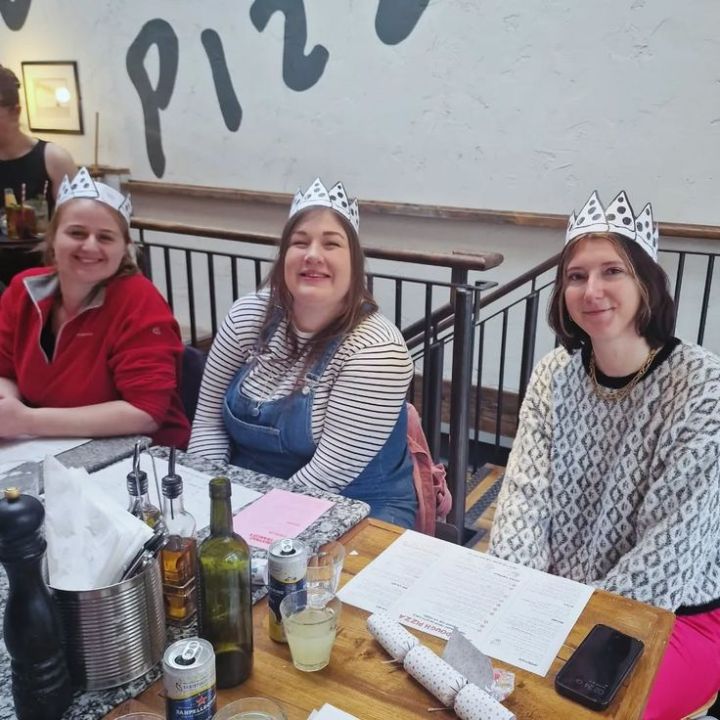 Sporting our funky pizza Christmas hats